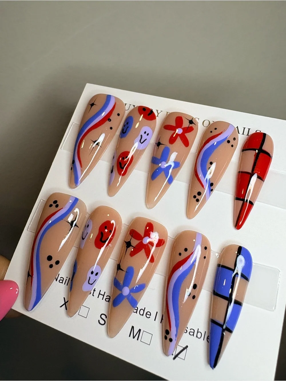 Handpainted Nude Stiletto Press-On Nails with Red & Blue Accents